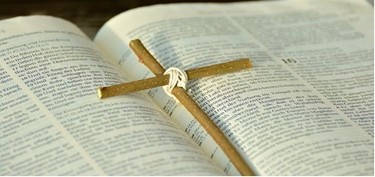 Cross on bible